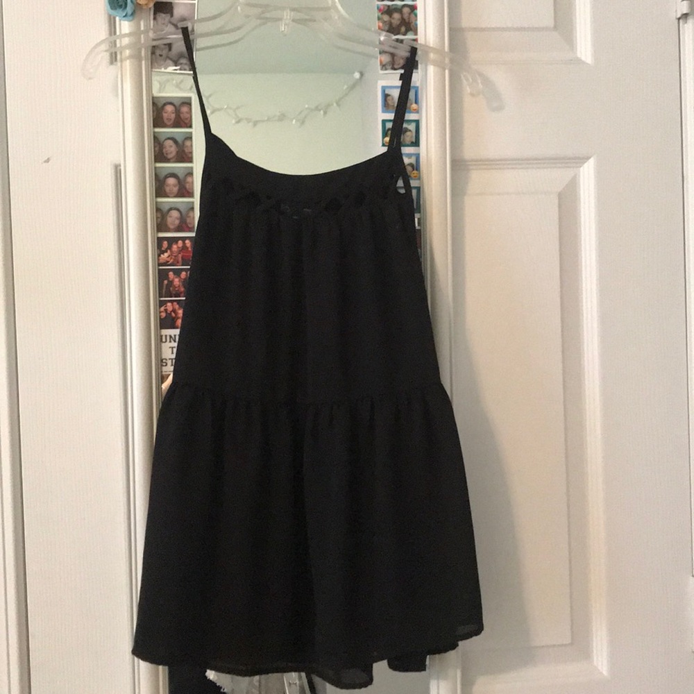 Black tank top, crosses in the front